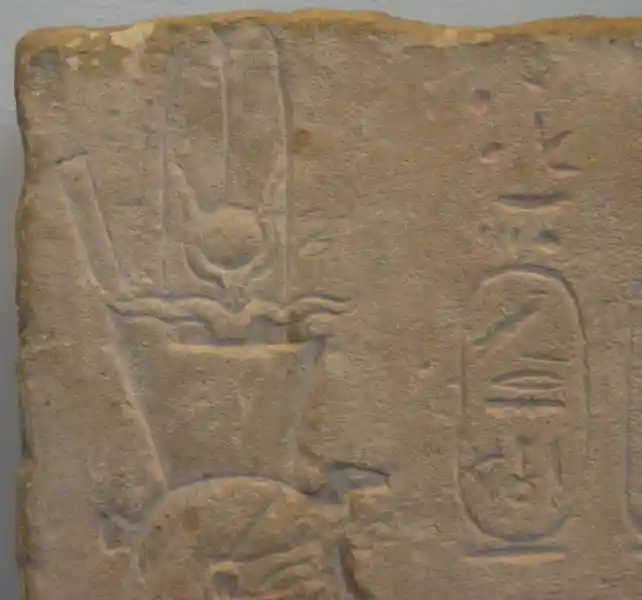 Solar disc in between horns on the upper left portion of the stela of Ptolemy II and Arsinoe II